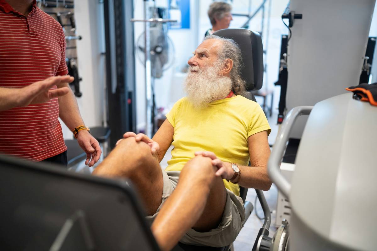 Bar chart showing muscle mass decline vs strength training benefits for men over 40