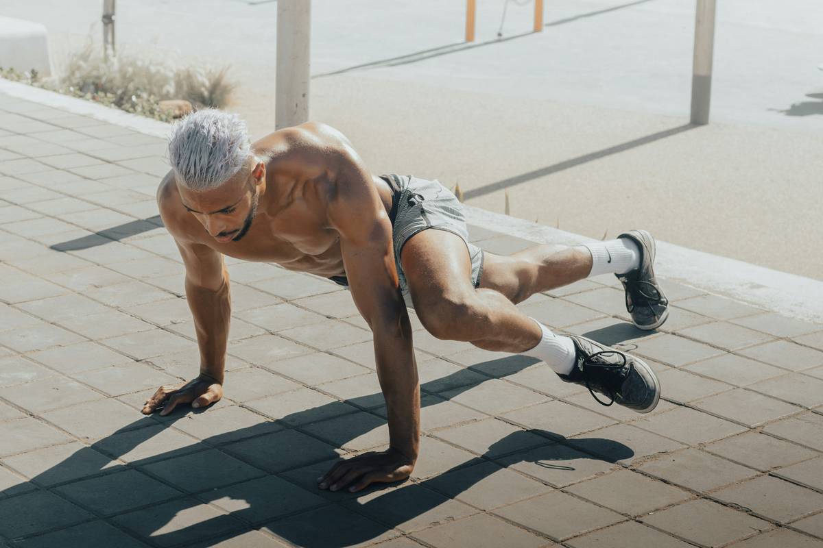 Chart showing decline in muscle mass and testosterone levels in men from age 30 to 60, with lifestyle factors that mitigate loss