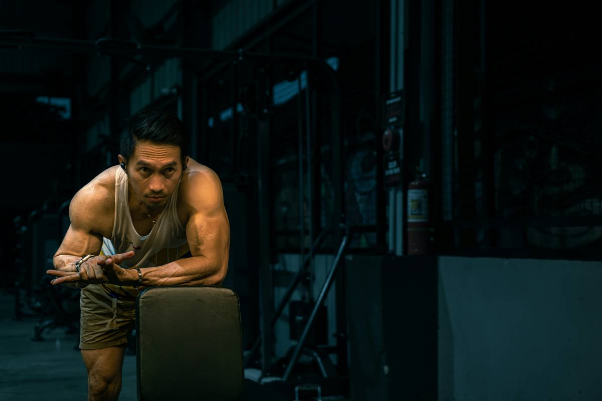 man over 40 using men over 40 workout app while doing mobility exercises at home